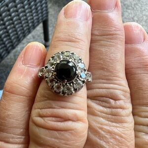 Evermore size 5 sterling silver ring with black onyx surrounded by white topaz.